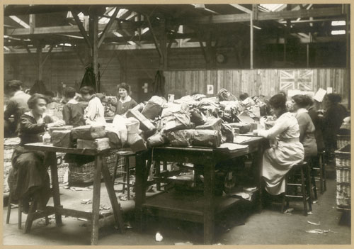 Image of women sorting broken parcels