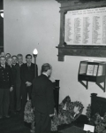 Image of Photograph of Belgian postal workers looking at a war memorial, 1947