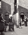 Image of Photograph of a postman in Wapping, 1935
